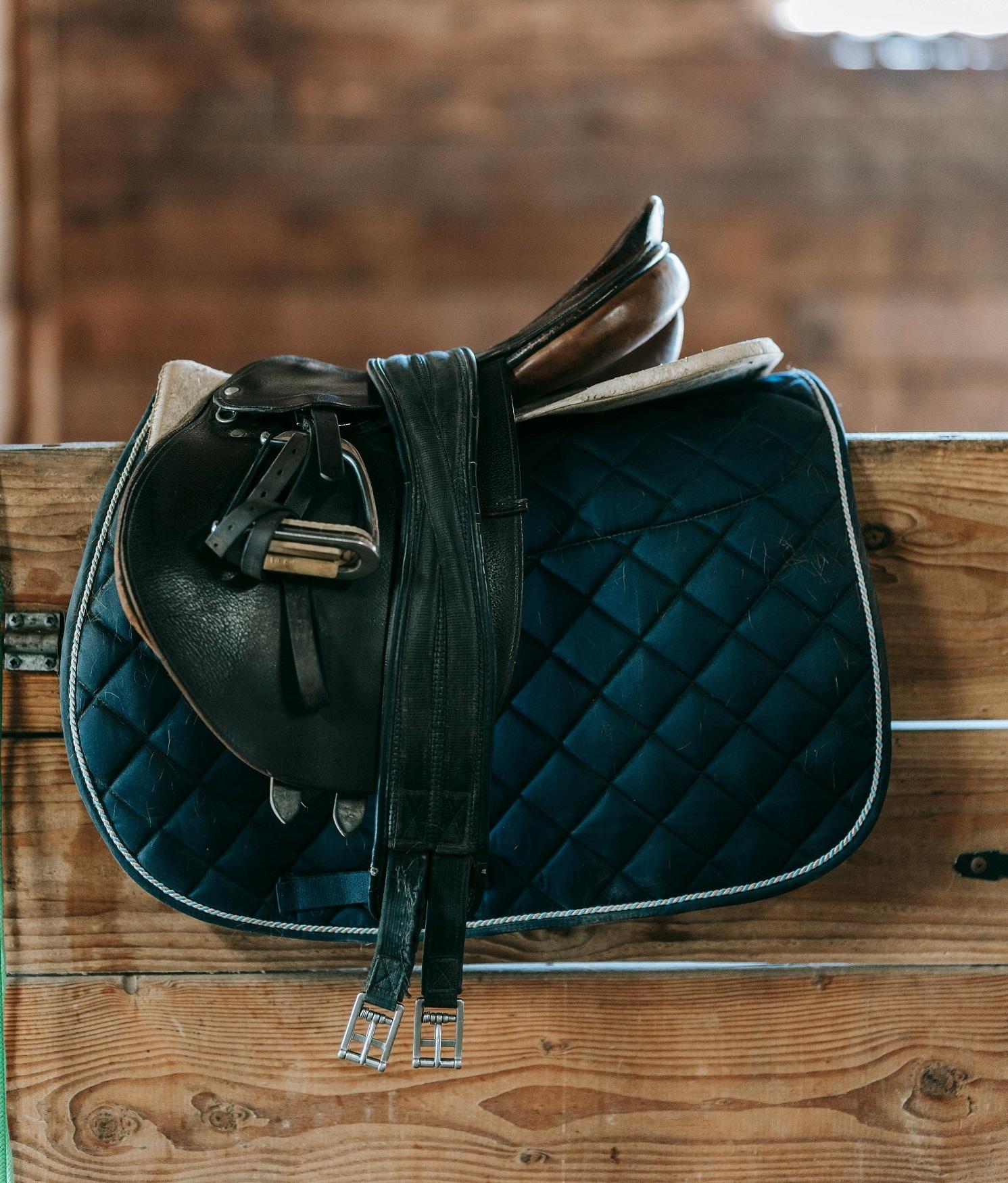 Photographing equestrian kit to list it for sale